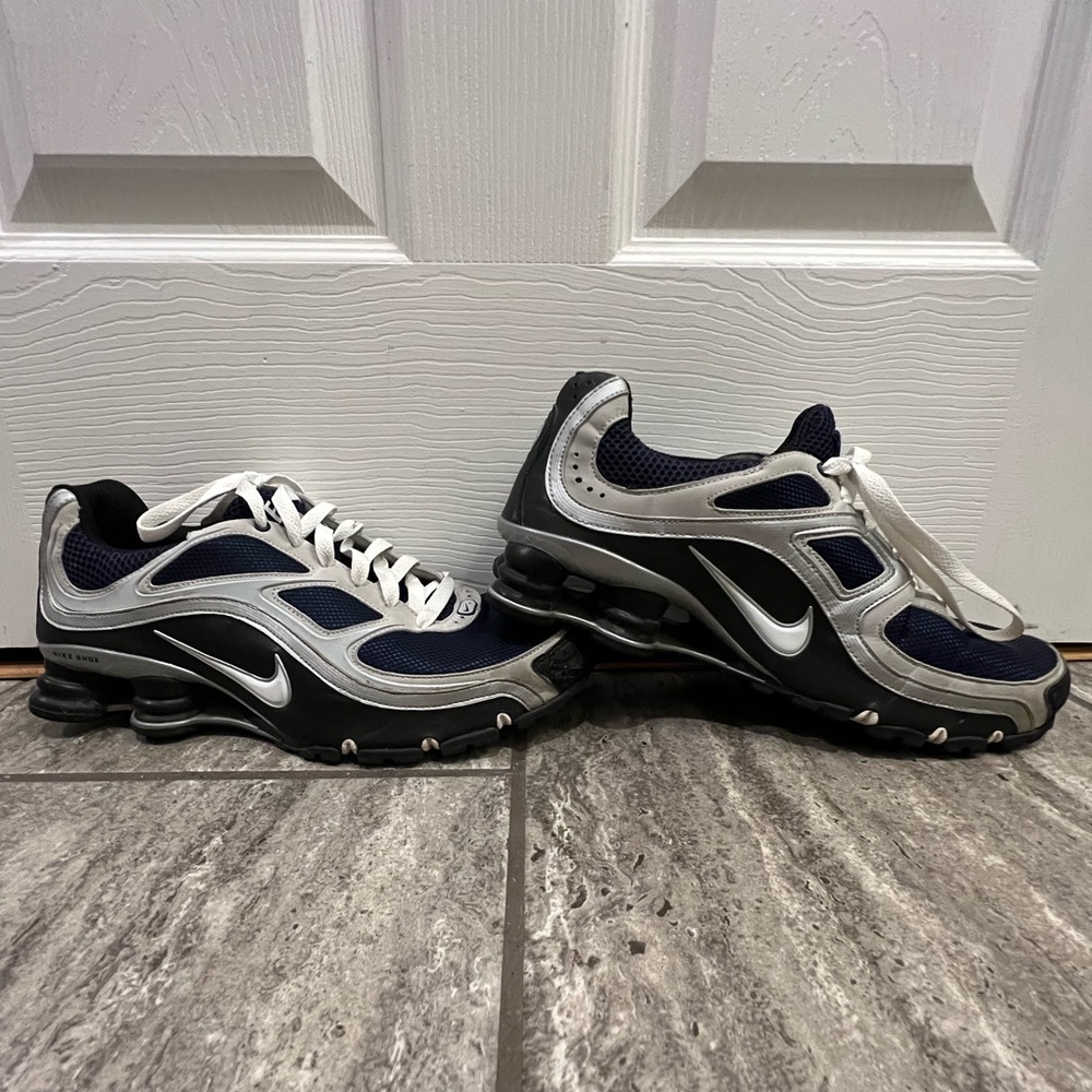 Navy and silver nike running shoes